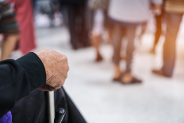 Disabled older man patient sitting wheelchair waiting services therapy  from Doctor in hospital clinic. Wheelchair is chair with wheels, used when walking difficult impossible to illness,  disability