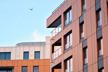 Modern apartment buildings on a sunny day with a blue sky. Facade of a modern apartment building
