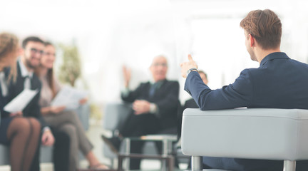 image is blurred.businessman conducting a meeting