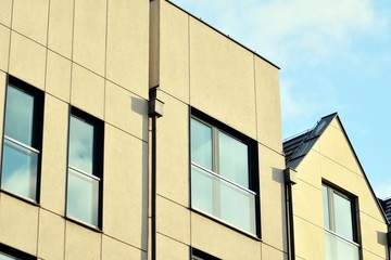 Modern apartment buildings on a sunny day with a blue sky. Facade of a modern apartment building
