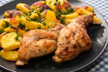 ham rabbit with potatoes cooked in the oven lying on a plate closeup