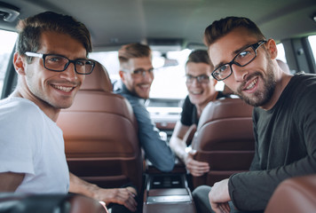 Young business man with colleagues test drive new car