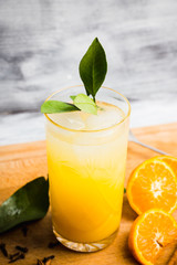Fresh cocktail with mandarines on the rustic background. Selective focus. Shallow depth of field.