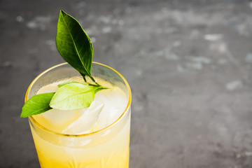 Fresh cocktail with mandarines on the rustic background. Selective focus. Shallow depth of field.