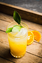 Fresh cocktail with mandarines on the rustic background. Selective focus. Shallow depth of field.