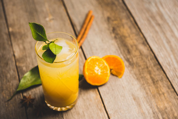 Fresh cocktail with mandarines on the rustic background. Selective focus. Shallow depth of field.