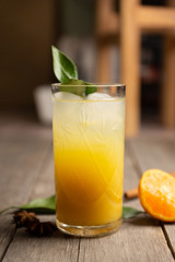 Fresh cocktail with mandarines on the rustic background. Selective focus. Shallow depth of field.