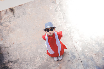 Asian Chinese boy in Traditional Chinese New Year outfit celebrating Lunar New Year