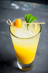 Fresh cocktail with mandarines on the rustic background. Selective focus. Shallow depth of field.