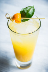 Fresh cocktail with mandarines on the rustic background. Selective focus. Shallow depth of field.