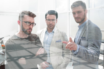 usiness people discuss problems standing in the office