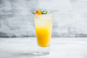 Fresh cocktail with mandarines on the rustic background. Selective focus. Shallow depth of field.
