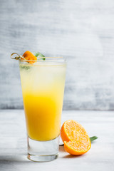 Fresh cocktail with mandarines on the rustic background. Selective focus. Shallow depth of field.