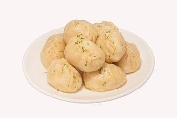 manti dumplings ravioli great big huge on a plate close-up menu for the cafe restaurant isolated white background