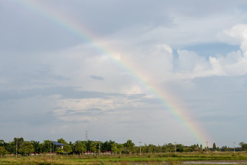 Rainbow and cloudy over the rural village.