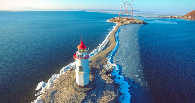 Aerial photography Tokarev lighthouse on the background of the blue sea.