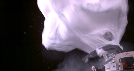 White airbag in the middle of deploying