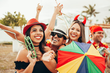 Brazilian Carnival. Group of Brazilian people in costume celebrating the carnival party in the city