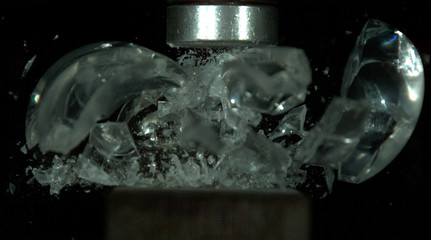 Glass Sphere being smashed to pieces by hydraulic press, shattering everywhere. Picture 2