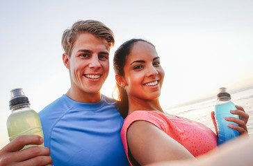 Happy couple taking a selfie during a jogging day