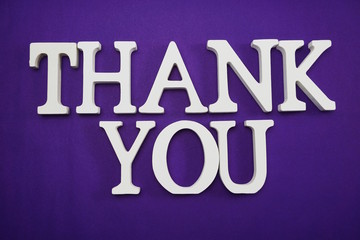 Thank You alphabet letters on purple background