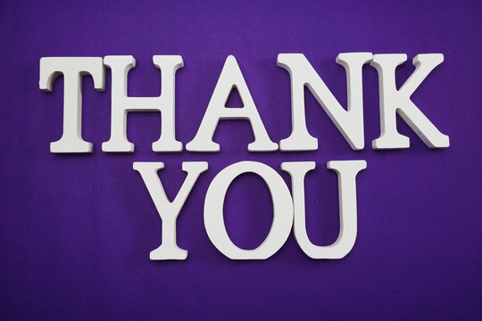 Thank You alphabet letters on purple background