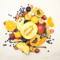 Fruits isolated white. Flat lay. Plum, apple, strawberry, blueberry, papaya, pineapple, lemon, orange, lime, kiwi, melon, apricot, pitaya and carambola on the white background.
