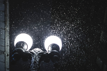 snowy night light post