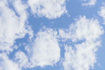 Obraz premium Beautiful blue sky background with white clouds