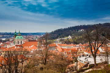 Fototapeta na wymiar Petrin hill and the beautiful Prague city old town seen form the Prague Castle viewpoint in an early spring day
