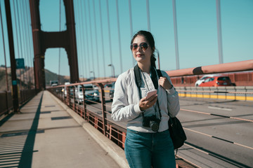 woman travel photographer walking on pedestrian