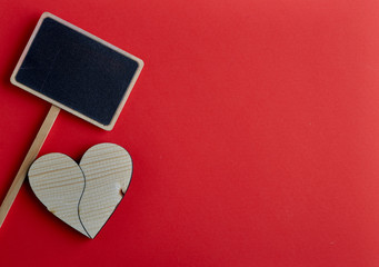 Valentines day wooden heart on red background