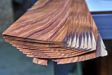 Veneer Santos Rosewood. Wood texture. Woodworking and carpentry production.