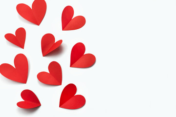 Red paper hearts on white background concept of Valentine's day