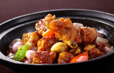 Delicious Chinese cuisine, onion and spare ribs in pot

