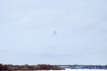 Performance of aerobatic team Russian Knights at the air show..Omsk, Russia - 19 March, 2016: Performance of Russian Knights at the air show..