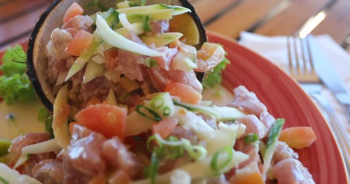 Local food Tahiti. Typical raw fish dish called Poisson Cru, aka Ota ika, a Polynesian dish and a National Dish of Tahiti, French Polynesia. High-end restaurant presentation.