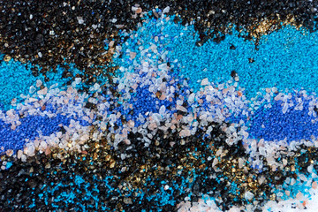 Layered colorful sand pattern. Marble style background. Blue and gold powder texture.