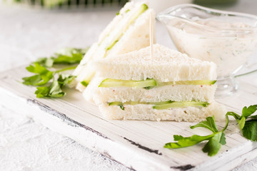 Summer snack mini sandwiches with cucumber and yogurt sauce