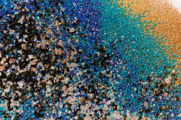 Layered colorful sand pattern. Marble style background. Blue and gold powder texture.