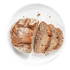 Sliced bread on a plate  isolated on  white background. Fresh Bread cutted in a  slices close up....