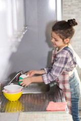 Mom and daughter do the dishes
