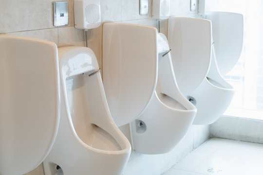 Side View Of Male Urinal With Sunlight Background