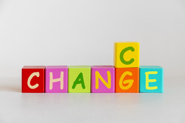 colorful wooden blocks toys with word change, business concept