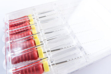 Endodontic instruments pack. Dental instruments for tooth canal cleaning. Tooth canal cleaning device. Endodontic files.