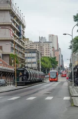 Foto op Plexiglas red bus in the street in the city © Mafer
