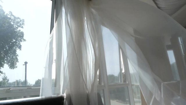 Abstract hotel room interior with waving curtain by fresh air
