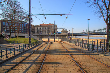 Fototapeta na wymiar Yellow tram and rails on the embankment of Budapest