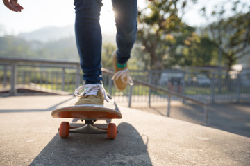 Skateboarder skateboarding at skatepark