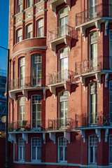 Fototapeta premium Red brick building in london with many balconies